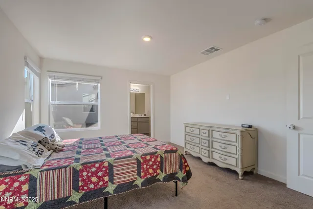 a bathroom with a double vanity sink mirror and shower