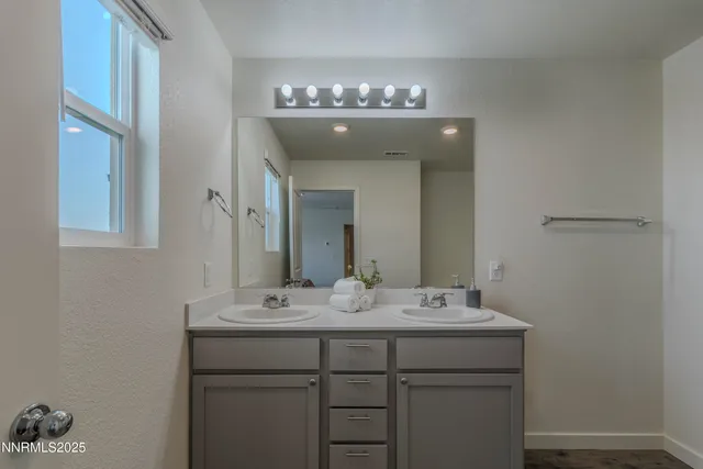 a bathroom with a shower a toilet and a sink