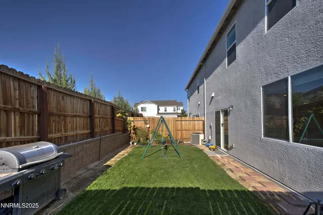 an aerial view of a house with a swimming pool