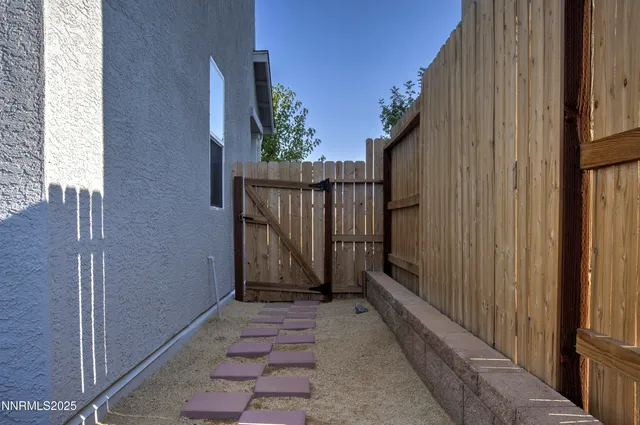 a living room with furniture and hard wood flooring
