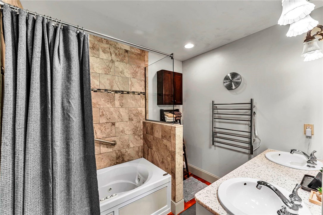 287 Pink Street Middlefield, NY 13326 - Photo 17 of 49 On suite bath with double sinks, jetted tub & show