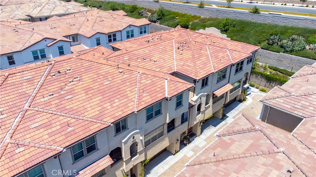an aerial view of a house with a yard