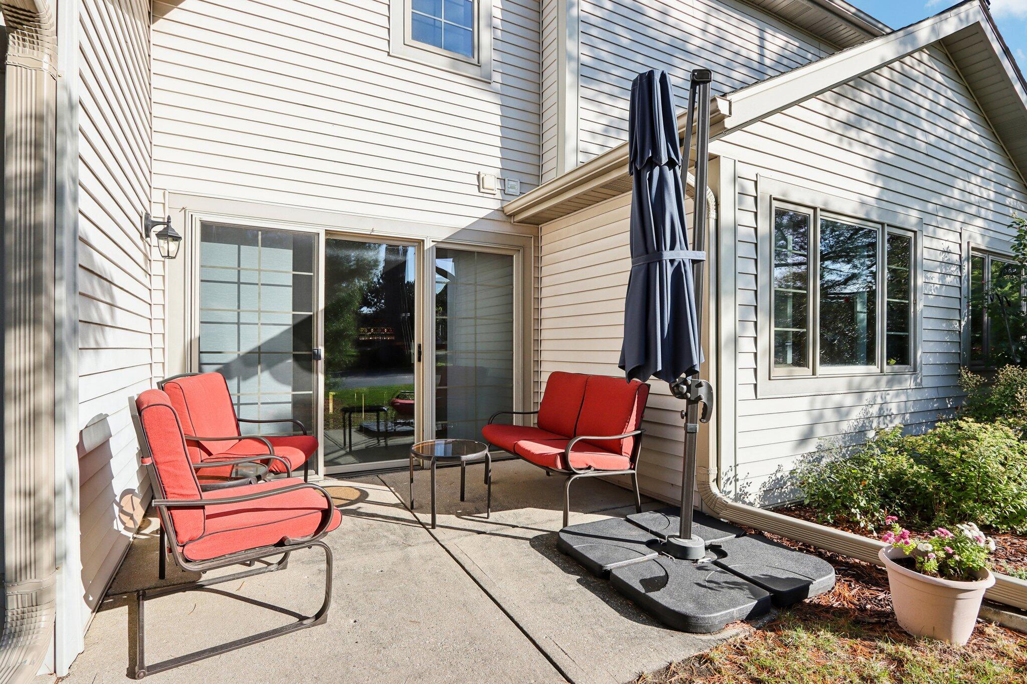 2264 Circle Ridge Road, Unit E Delafield, WI 53018 - Photo 28 of 35 Sliding doors to patio area