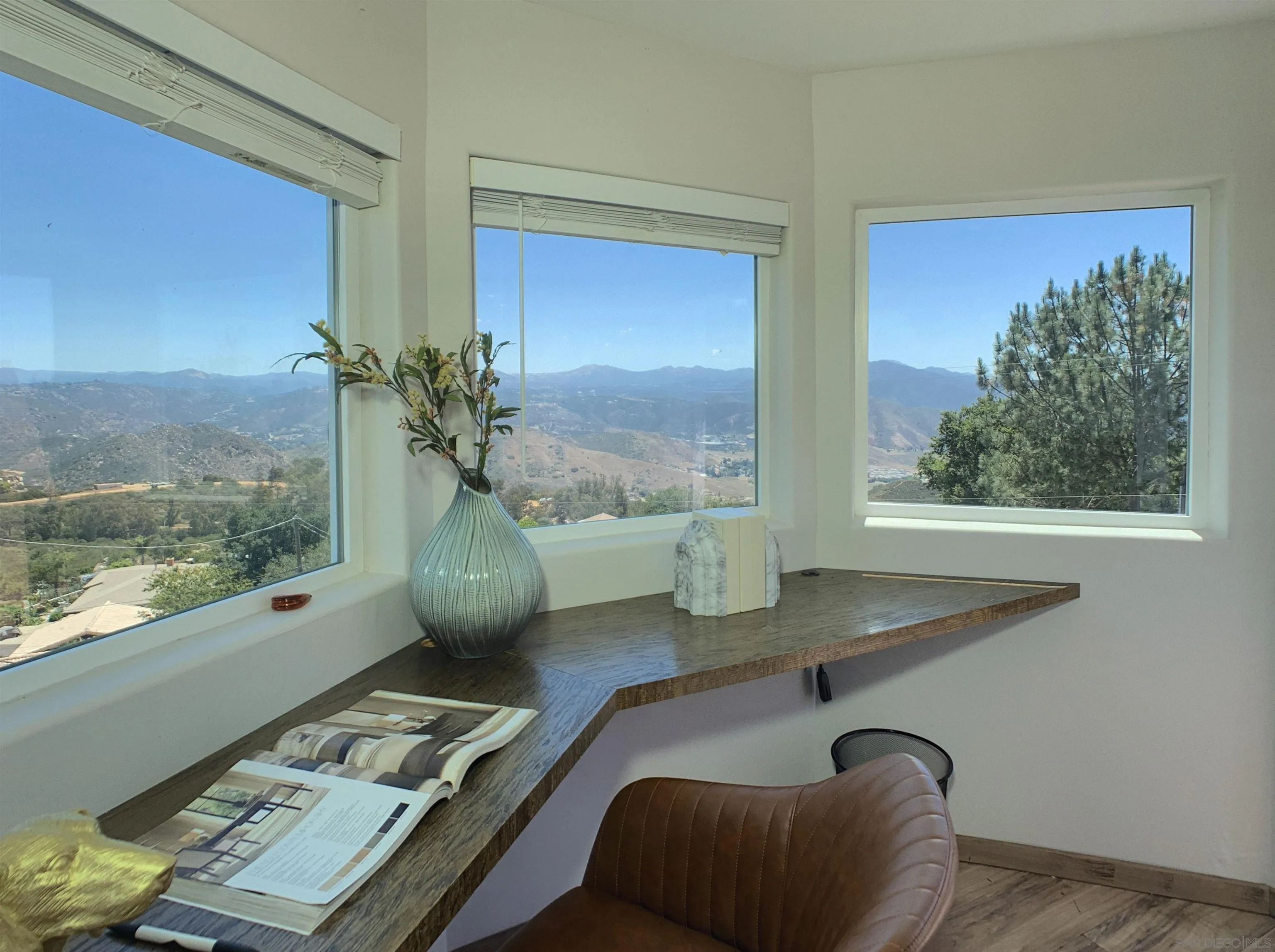 205 Highline Trail El Cajon, CA 92021 - Photo 27 of 45 a view of a dining room with furniture and wooden floor