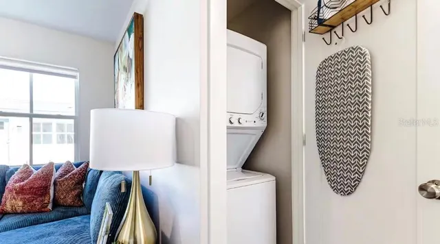 a kitchen with stainless steel appliances granite countertop white cabinets and a stove