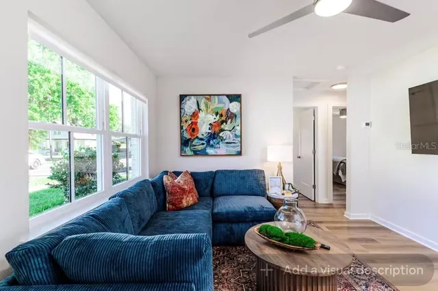 a living room with furniture and a large window