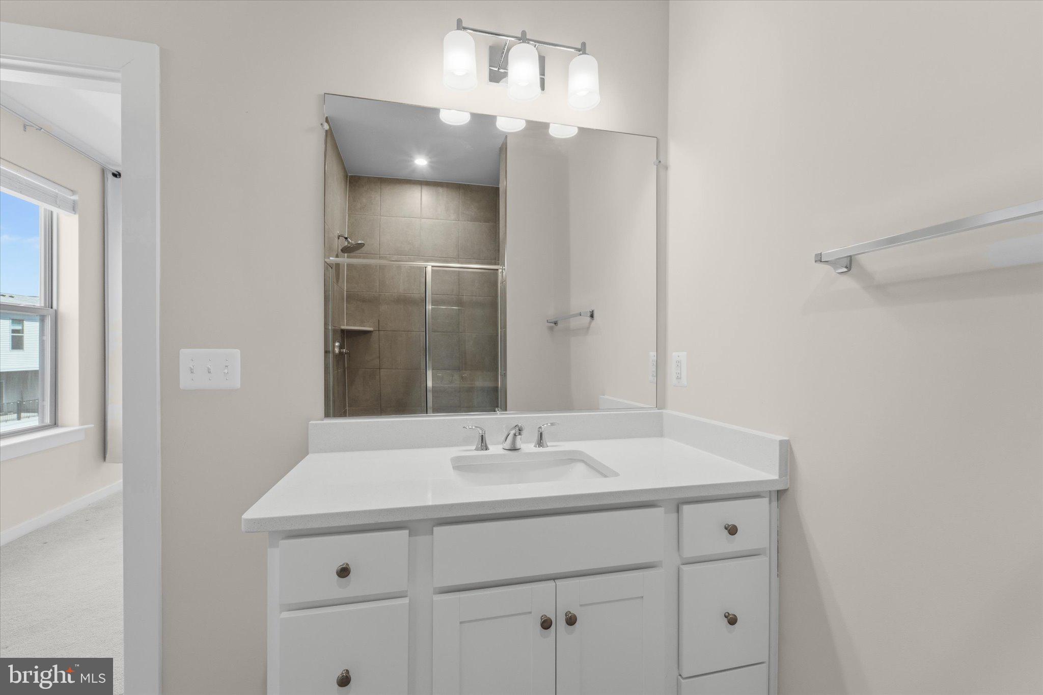 13695 Innovation Station Loop, Unit 77B Herndon, VA 20171 - Photo 20 of 36 Primary Bath with Double Vanity & Walk-In Shower