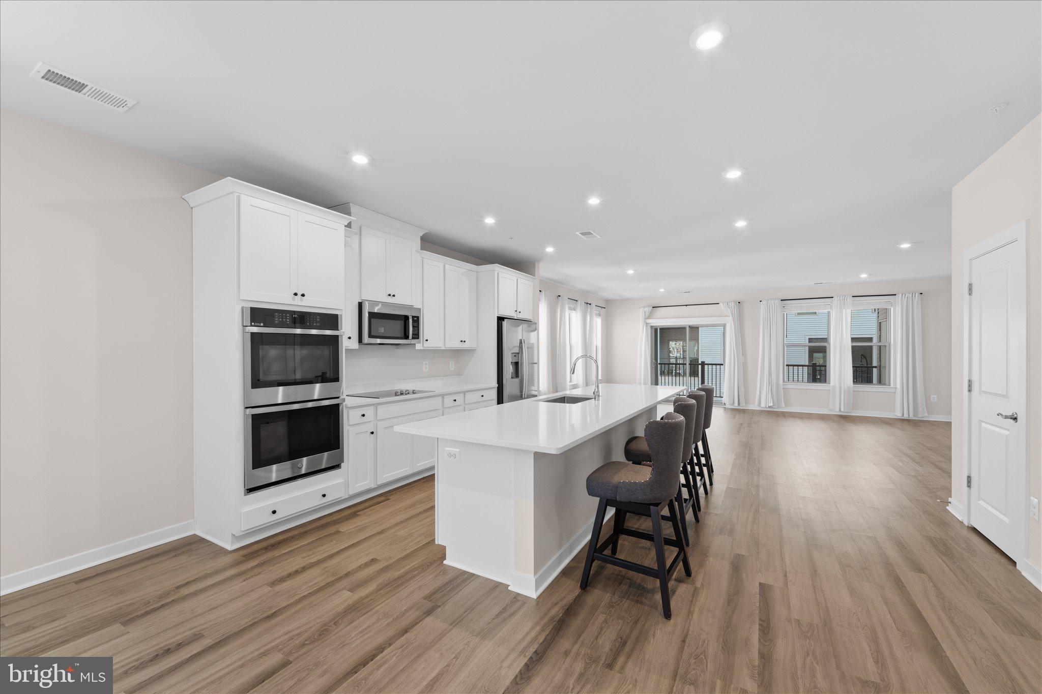 13695 Innovation Station Loop, Unit 77B Herndon, VA 20171 - Photo 2 of 36 Gourmet Kitchen with Oversized Island