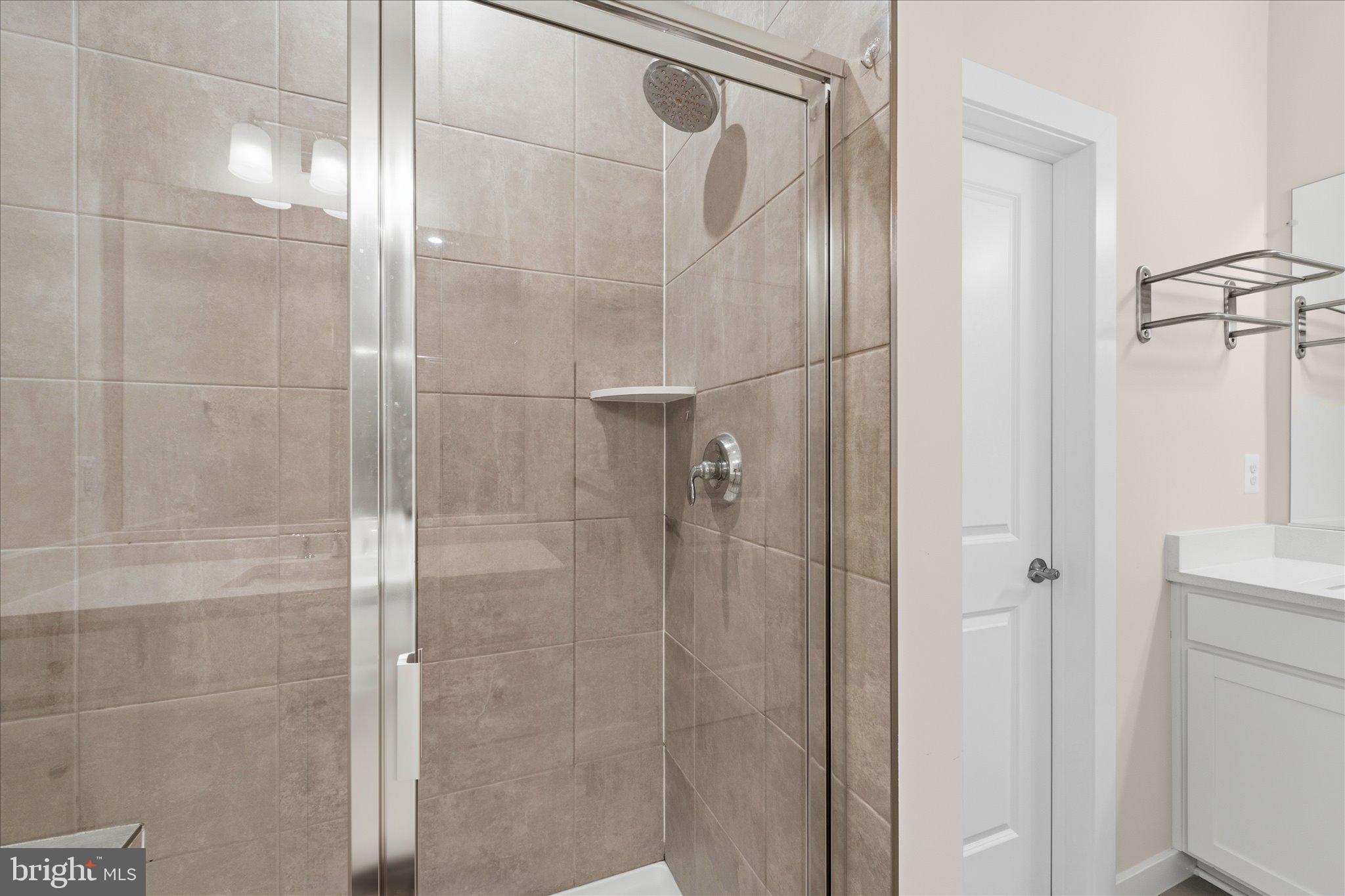 13695 Innovation Station Loop, Unit 77B Herndon, VA 20171 - Photo 21 of 36 Primary Bath with Double Vanity & Walk-In Shower