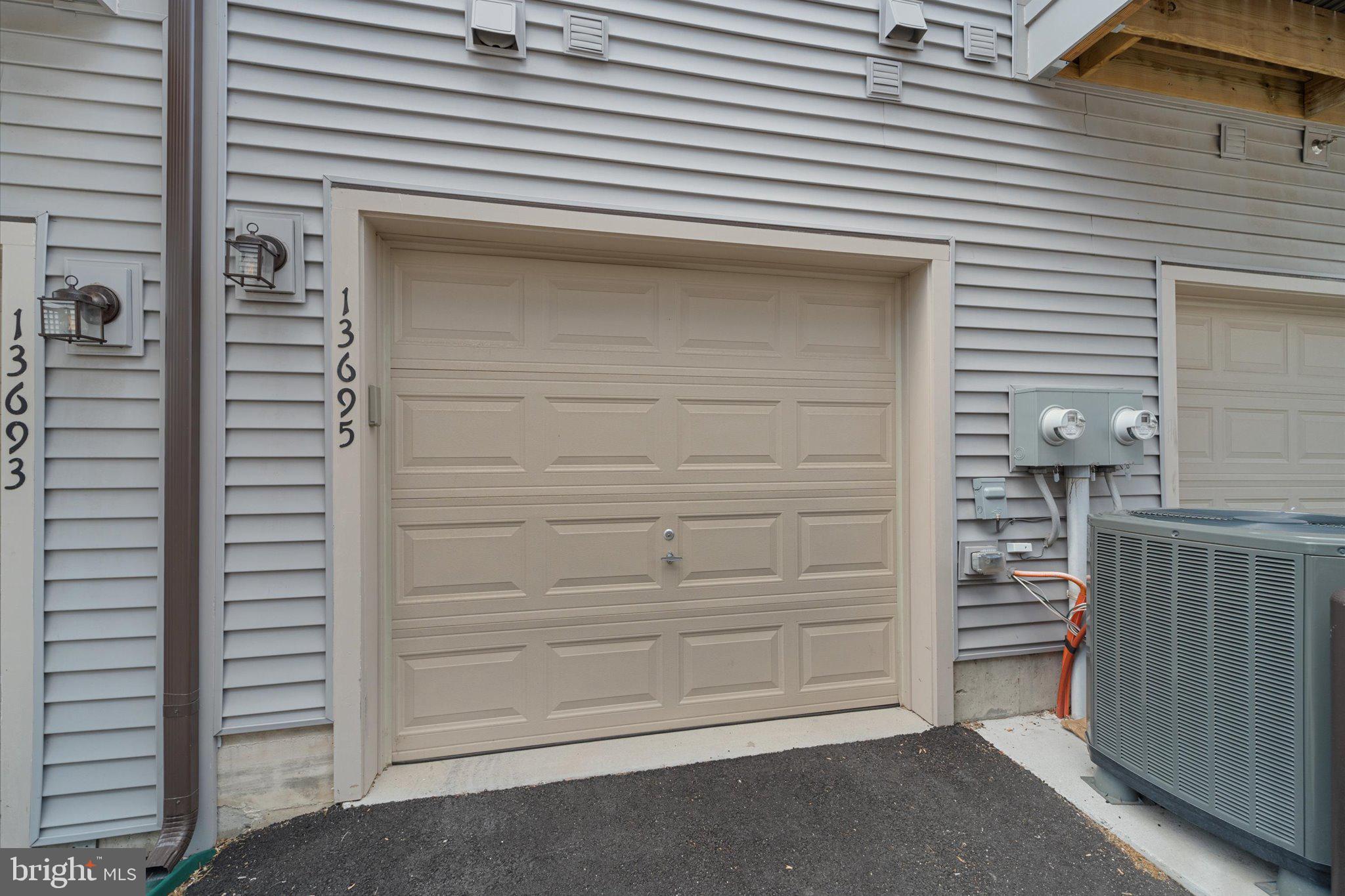 13695 Innovation Station Loop, Unit 77B Herndon, VA 20171 - Photo 29 of 36 Attached Garage with Additional Storage