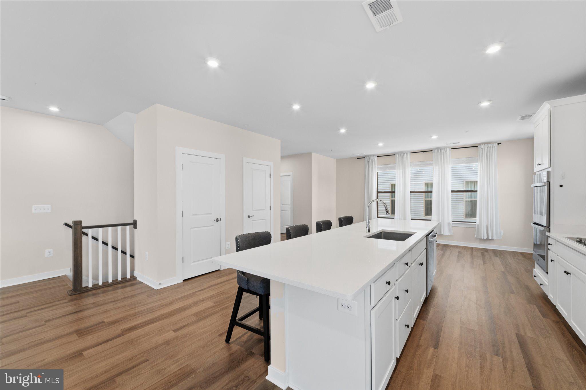 13695 Innovation Station Loop, Unit 77B Herndon, VA 20171 - Photo 3 of 36 Open-Concept Kitchen with Seating & Storage