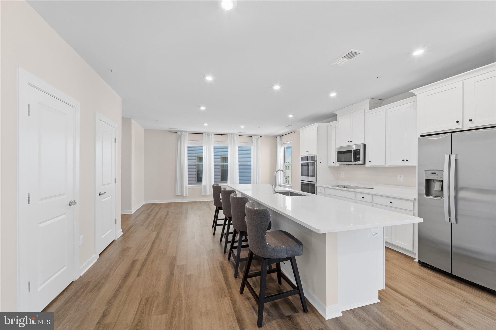 13695 Innovation Station Loop, Unit 77B Herndon, VA 20171 - Photo 4 of 36 Chef’s Kitchen with Modern Finishes