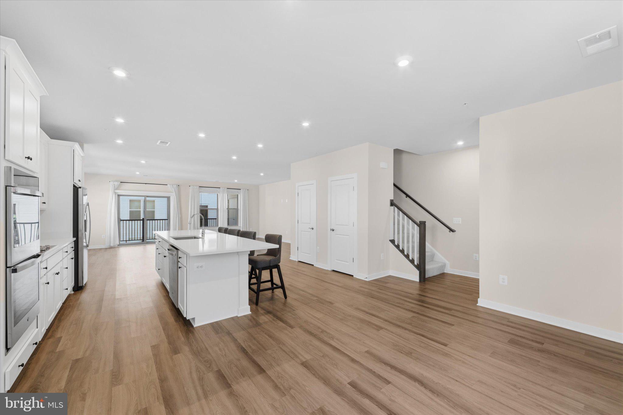 13695 Innovation Station Loop, Unit 77B Herndon, VA 20171 - Photo 5 of 36 Kitchen Flowing into Main Living Area