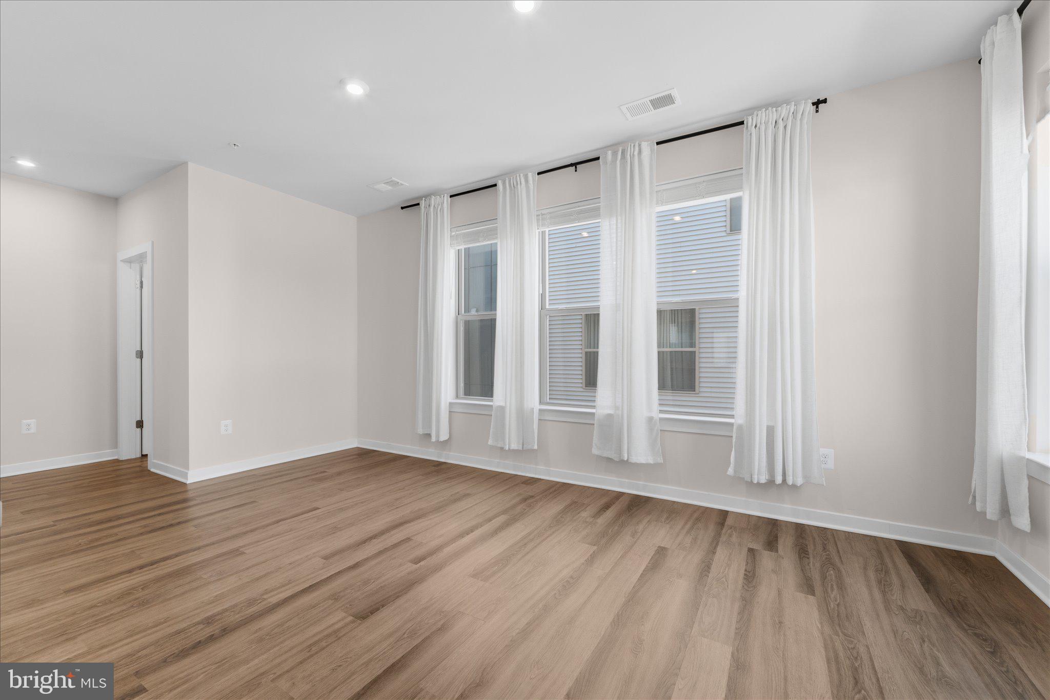 13695 Innovation Station Loop, Unit 77B Herndon, VA 20171 - Photo 9 of 36 Bright Living Room with Flexible Layout