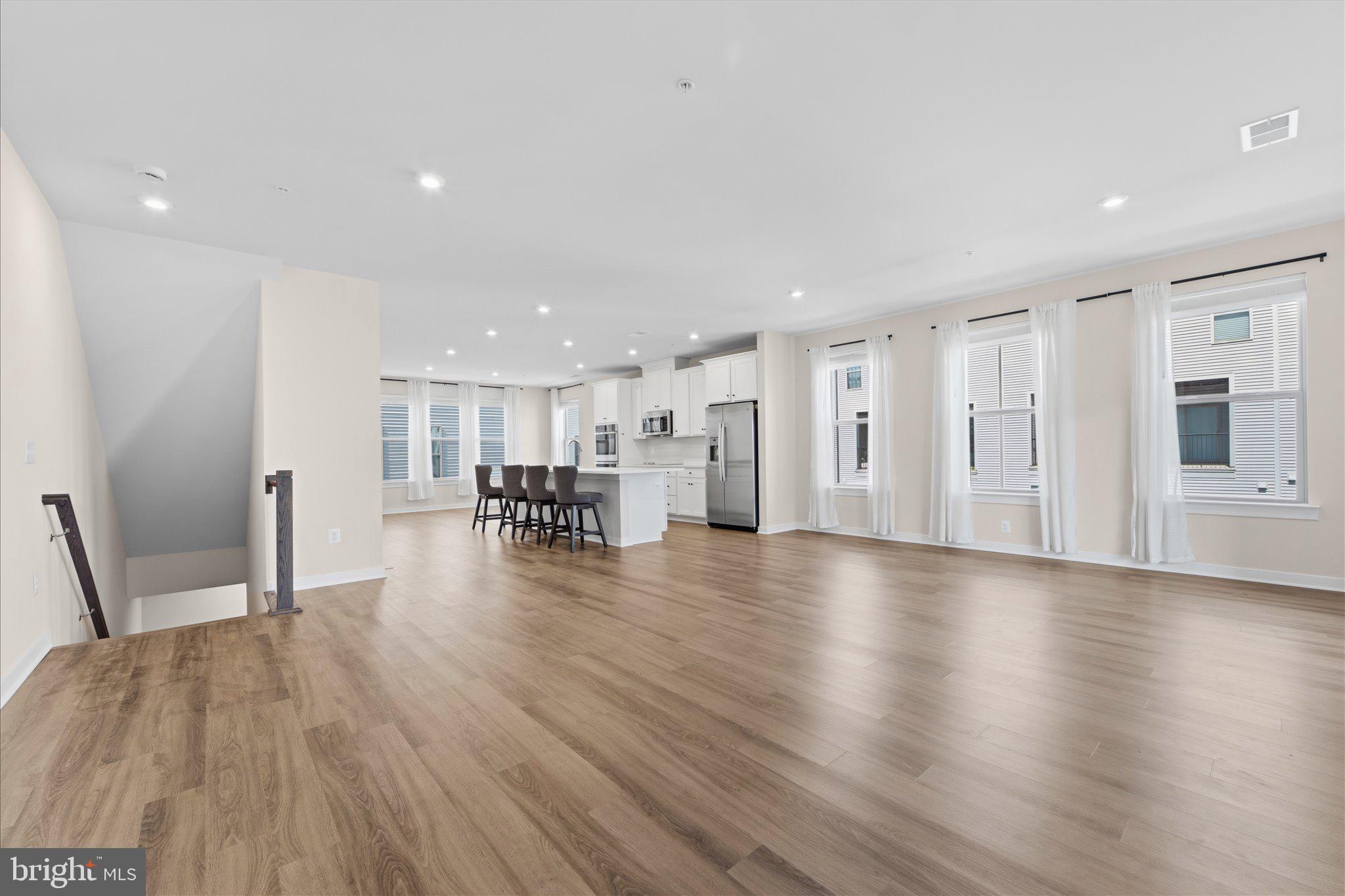 13695 Innovation Station Loop, Unit 77B Herndon, VA 20171 - Photo 10 of 36 Living Room with Large Windows & Natural Light