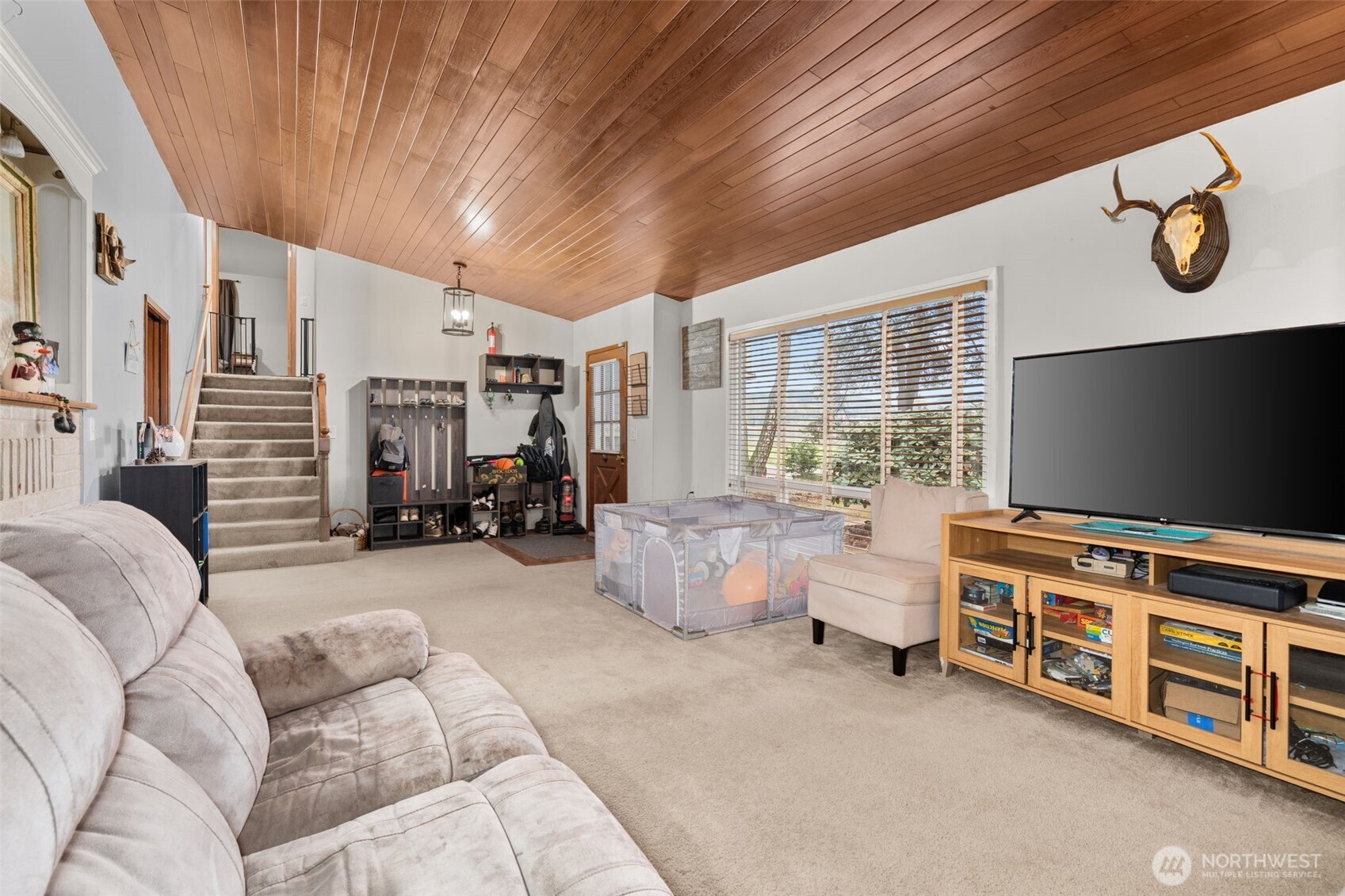 137 Aldrich Road Mossyrock, WA 98564 - Photo 16 of 30 a living room with furniture and a flat screen tv