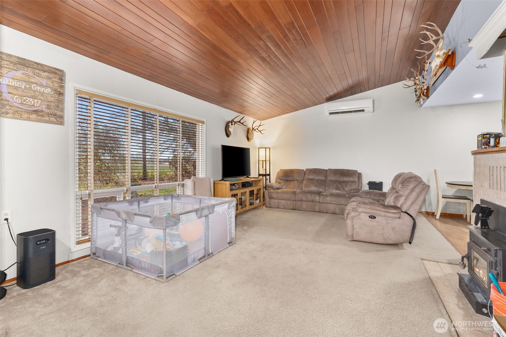 137 Aldrich Road Mossyrock, WA 98564 - Photo 17 of 30 a living room with furniture flat screen tv and a large window