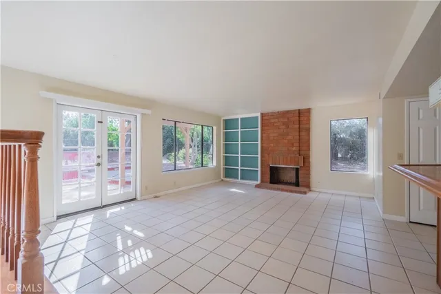 a view of a livingroom with furniture and windows