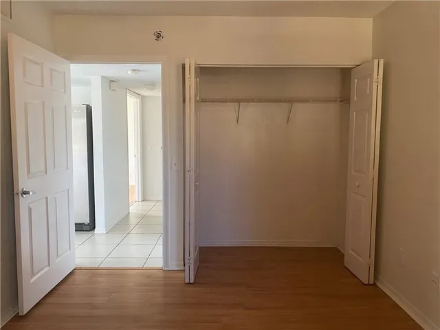 an empty room with wooden floor