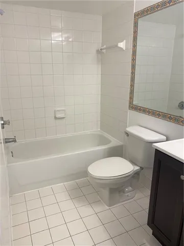a bathroom with a toilet a sink and a bathtub