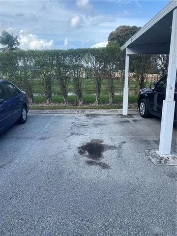 a view of a car parked in front of a house