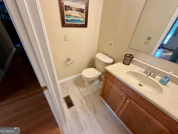 a bathroom with a sink a mirror and a shower