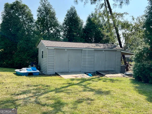 a view of a dry yard with wooden floor