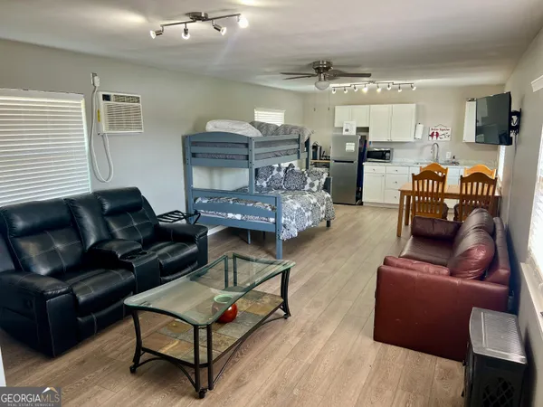 a backyard of a house with table and chairs