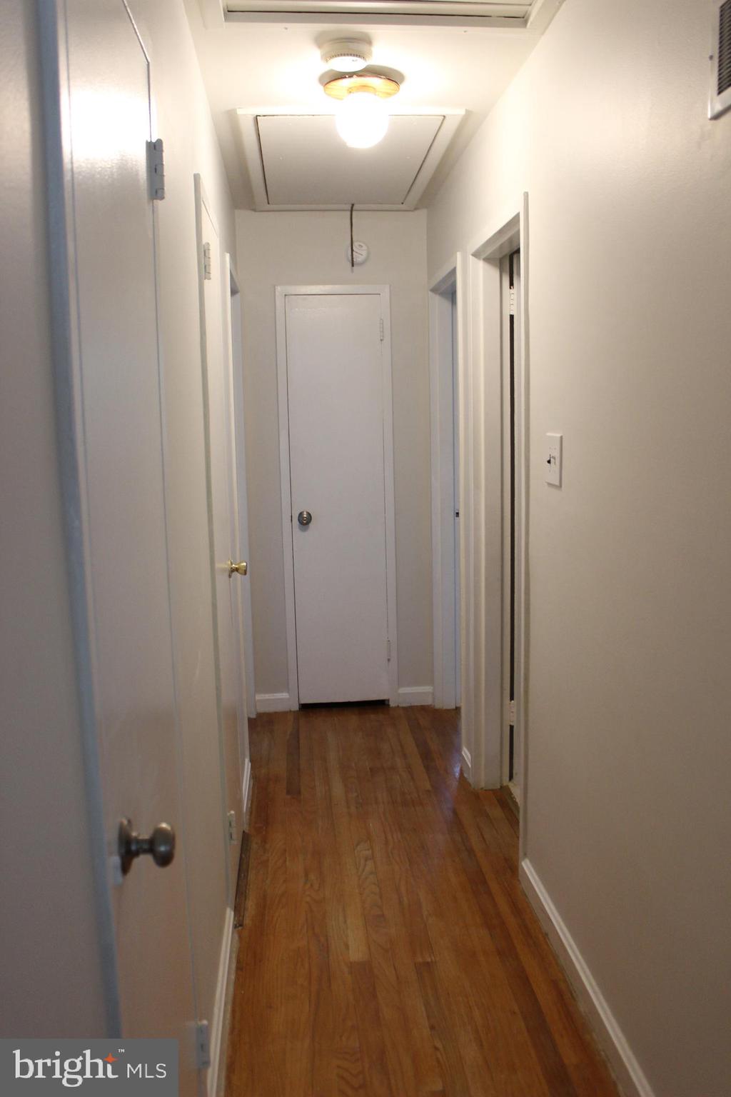 911 Snure Road Silver Spring, MD 20901 - Photo 14 of 24 Hallway with hardwood floors