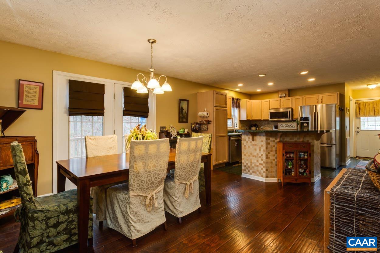 39 Paynes Mill Road Troy, VA 22974 - Photo 12 of 54 a view of a dining room with furniture and wooden floor