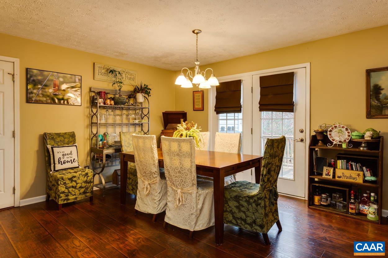 39 Paynes Mill Road Troy, VA 22974 - Photo 13 of 54 a view of a dining room with furniture and wooden floor