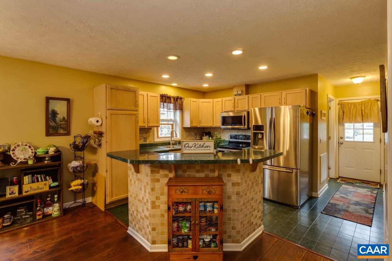 39 Paynes Mill Road Troy, VA 22974 - Photo 14 of 54 a kitchen with stainless steel appliances granite countertop a refrigerator a stove and a refrigerator