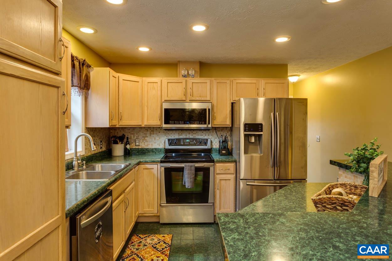 39 Paynes Mill Road Troy, VA 22974 - Photo 15 of 54 a kitchen with stainless steel appliances granite countertop a refrigerator a stove and a sink