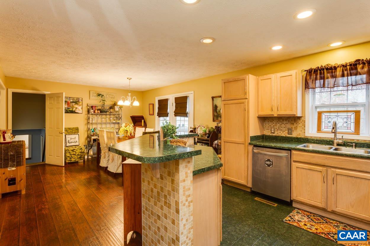 39 Paynes Mill Road Troy, VA 22974 - Photo 17 of 54 a kitchen with lots of counter top space and dining table