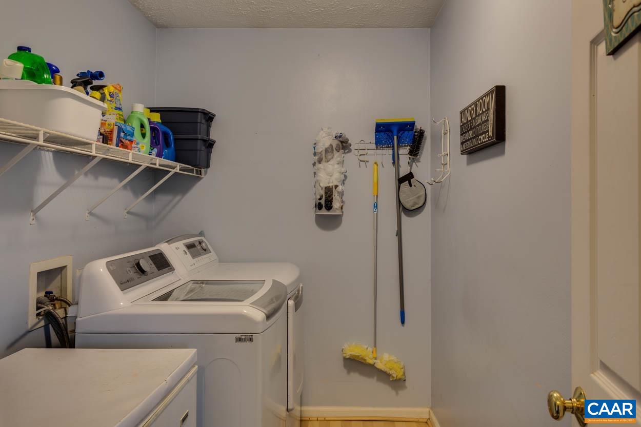 39 Paynes Mill Road Troy, VA 22974 - Photo 19 of 54 a utility room with dryer and washer