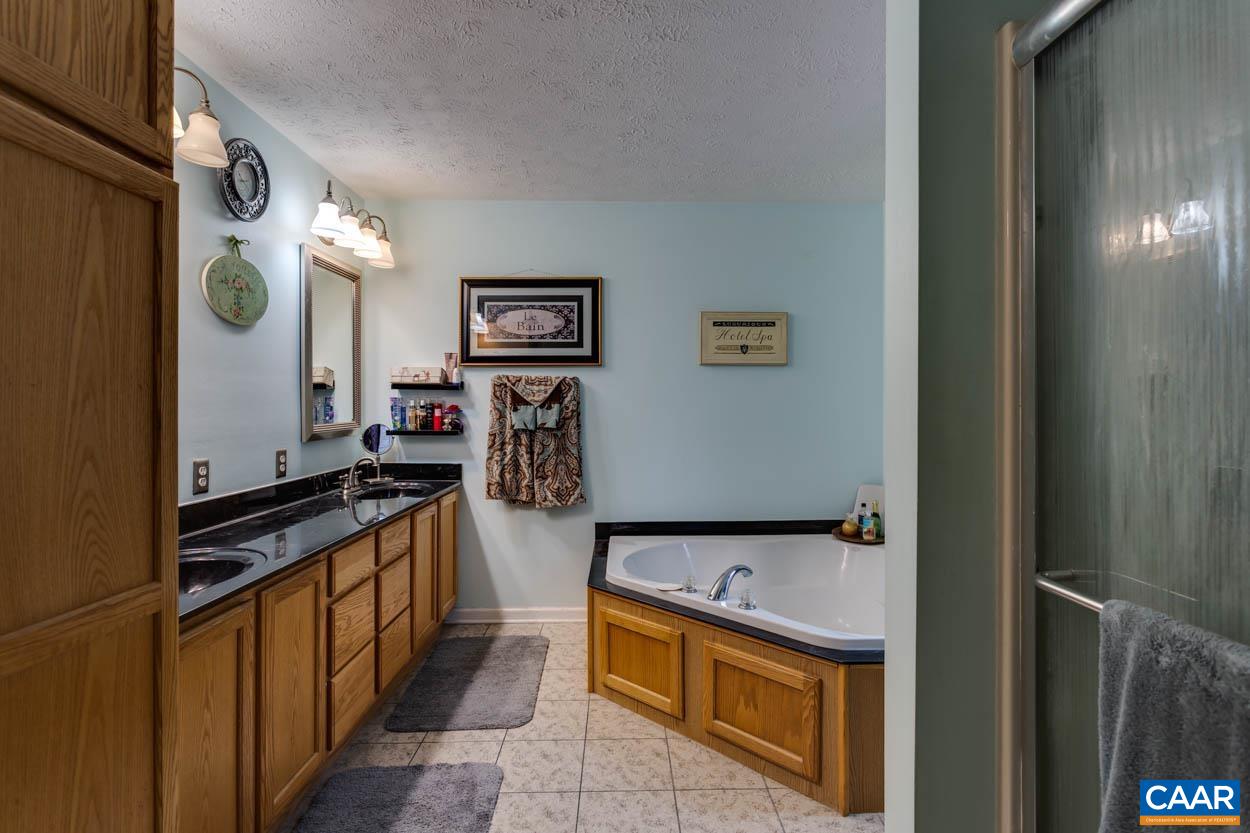 39 Paynes Mill Road Troy, VA 22974 - Photo 22 of 54 a kitchen with stainless steel appliances granite countertop a refrigerator and a stove