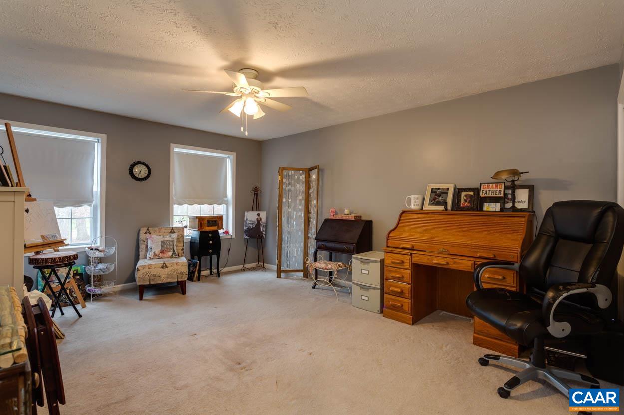 39 Paynes Mill Road Troy, VA 22974 - Photo 28 of 54 a room with furniture a air conditioner vent and a window