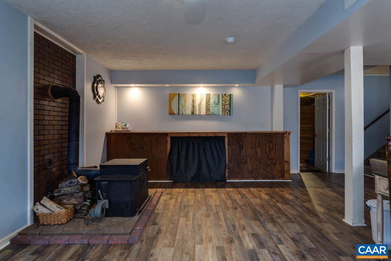 39 Paynes Mill Road Troy, VA 22974 - Photo 34 of 54 a living room with furniture and a flat screen tv