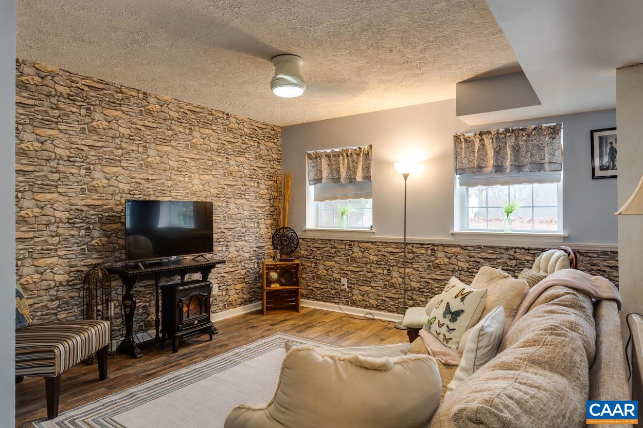 39 Paynes Mill Road Troy, VA 22974 - Photo 36 of 54 a living room with furniture and a flat screen tv
