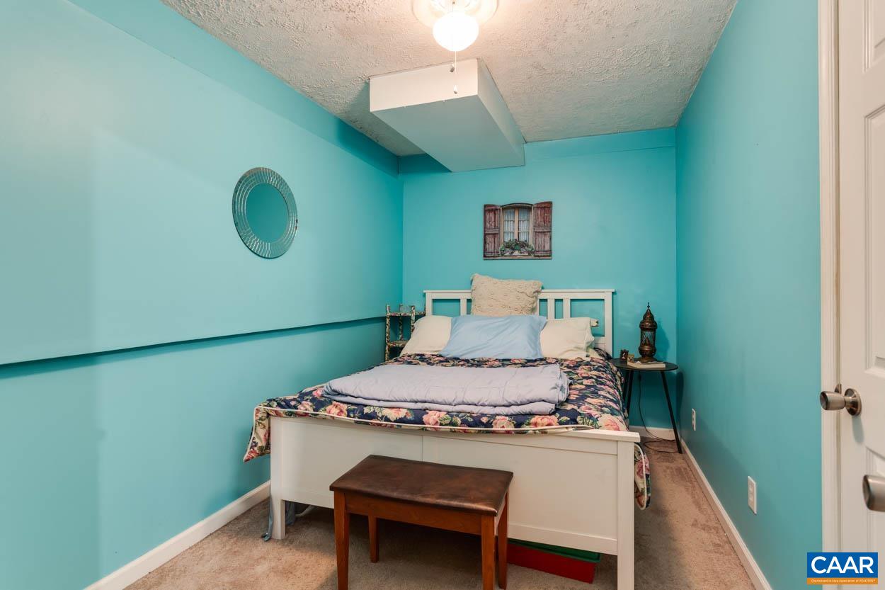 39 Paynes Mill Road Troy, VA 22974 - Photo 39 of 54 a bed room with a bed and a chair