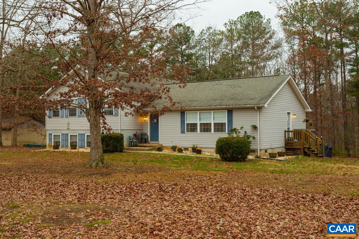 39 Paynes Mill Road Troy, VA 22974 - Photo 5 of 54 a view of a house with a large tree in front of a house