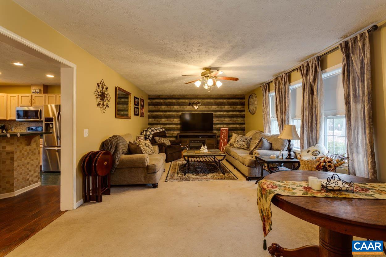 39 Paynes Mill Road Troy, VA 22974 - Photo 7 of 54 a livingroom with furniture and large windows