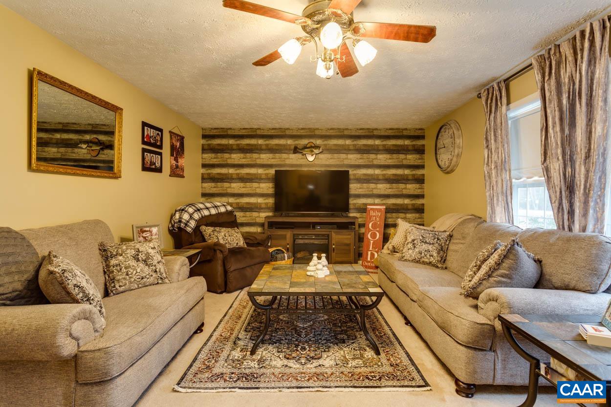 39 Paynes Mill Road Troy, VA 22974 - Photo 9 of 54 a living room with furniture and a flat screen tv