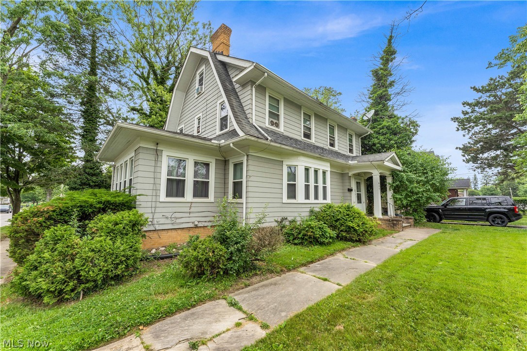317 Center Road Bedford, OH 44146 - Photo 2 of 16 View of front of house featuring a front yard