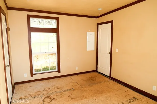 a view of an empty room and window