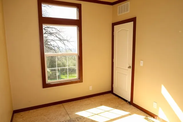 a view of an empty room and window