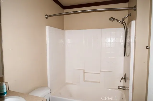 a bathroom with a shower and a toilet