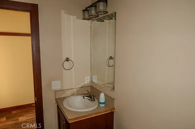 a bathroom with a sink a mirror and shower