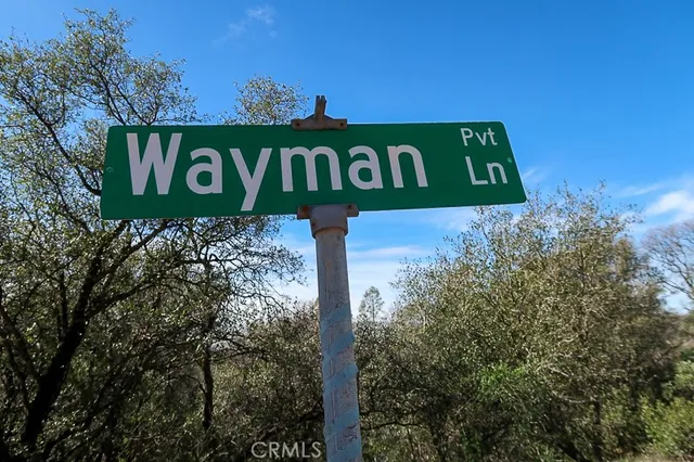a sign broad in front of the red door