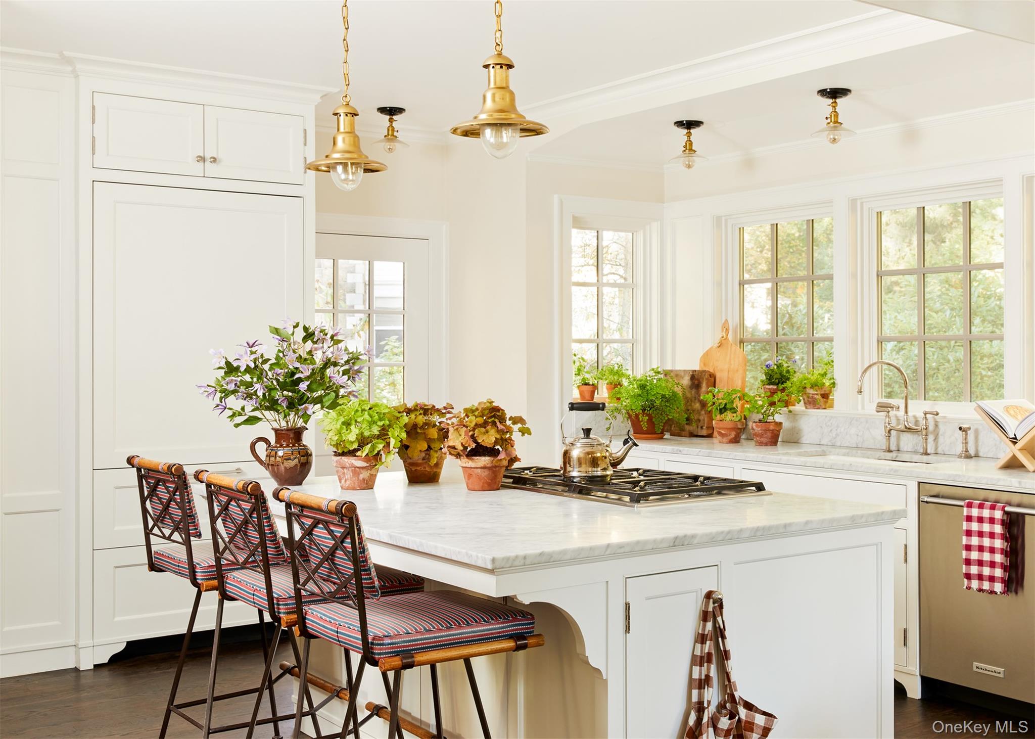 86 Pondfield Road West Bronxville, NY 10708 - Photo 11 of 30 a dining table with chairs and a chandelier